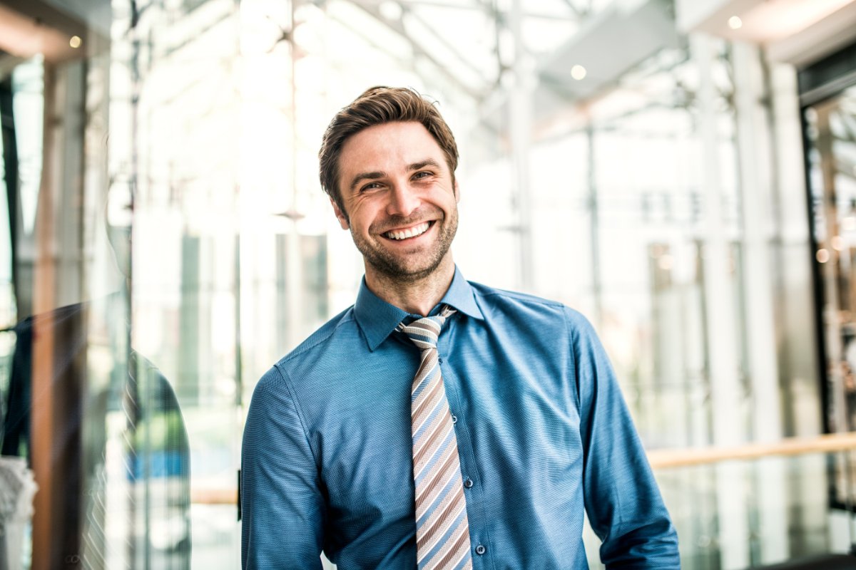 A Portrait Of A Young Businessman Standing Inside C6AWD9U 1
