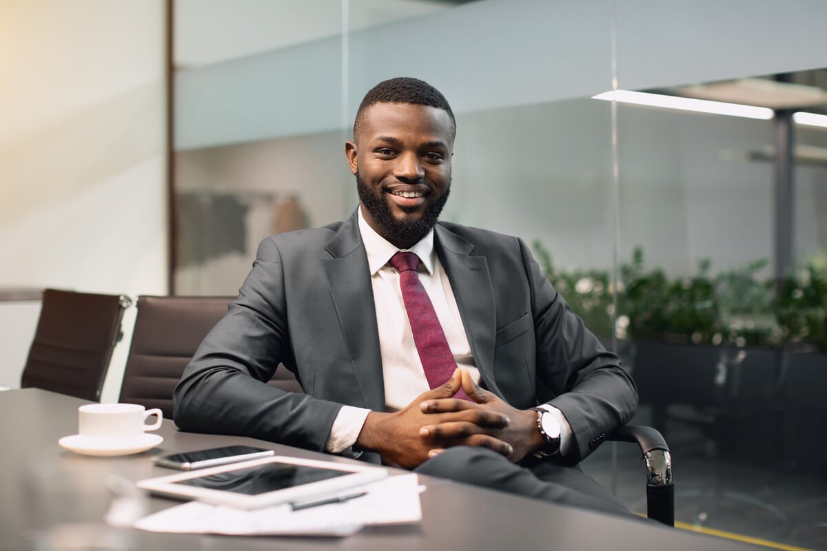 Cheerful Black Guy Ceo Sitting At Conference Hall 2025 03 18 17 22 38 Utc